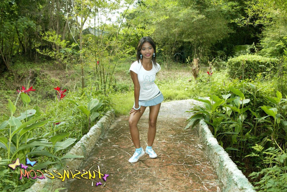 15P Asian Teen Tussinee doing some public flashing in a dinosaur park