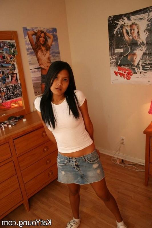 15P Kat is cute exotic thai undressing in her bedroom