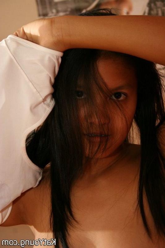 15P Kat is cute exotic thai undressing in her bedroom