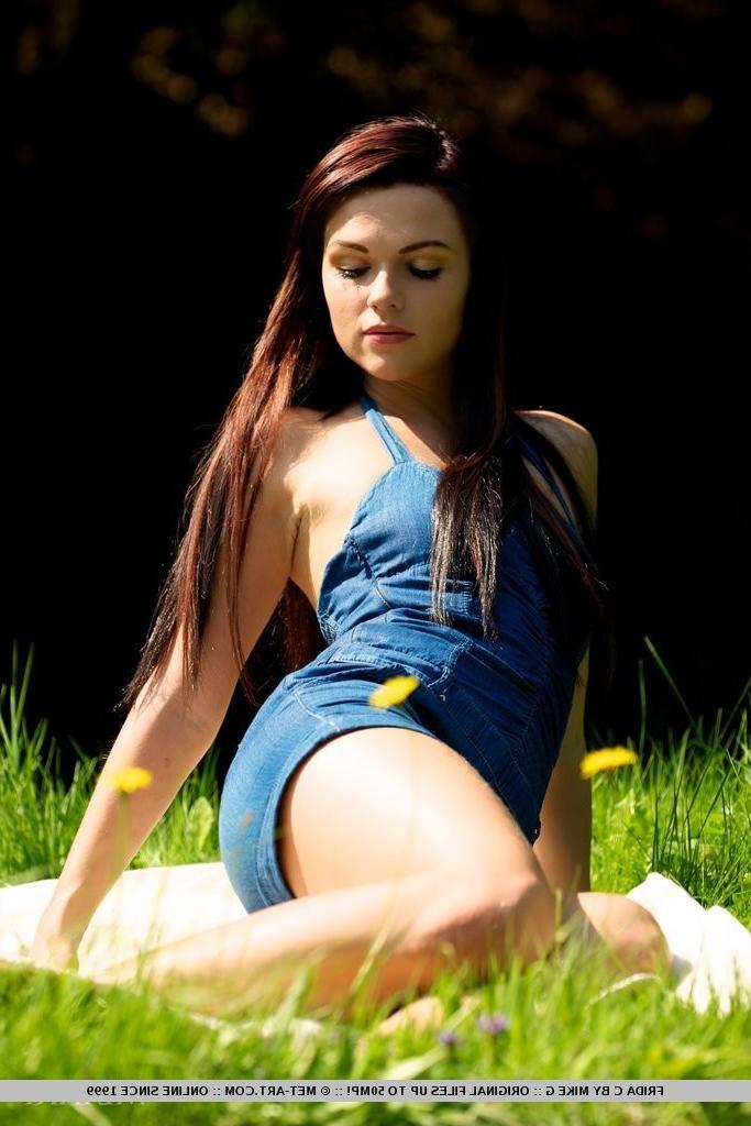 18P Pretty brunette poses nude in the park!