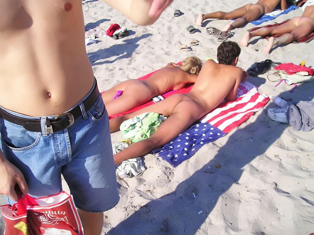 9P Sexy teens play together at a public beach