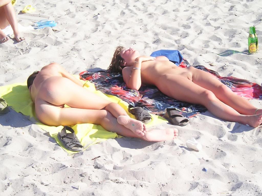 9P Sexy teens play together at a public beach