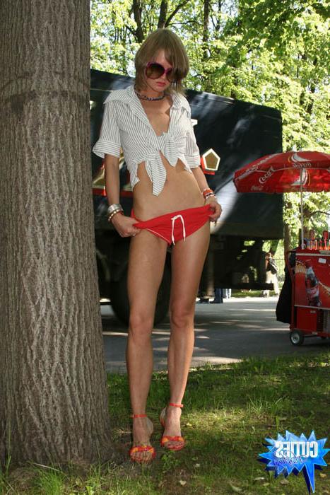 16P Slim teen hottie walks topless in the city park