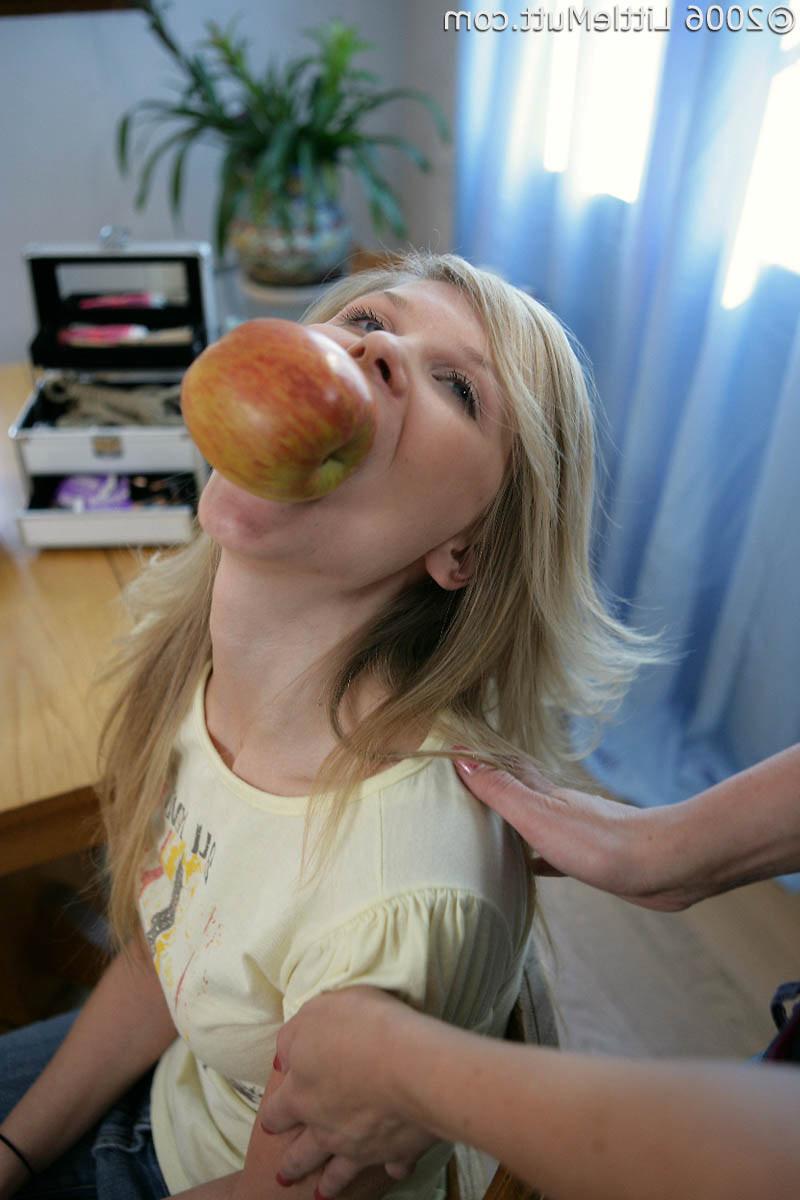 16P babe gets tied to a chair with an apple in her mouth