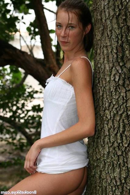 16P brunette cutie posing in the park