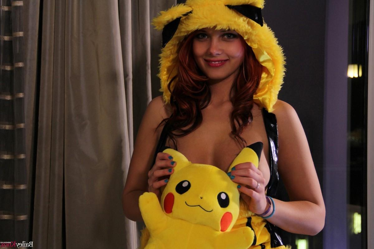 12P Cute teen posing with a Pikachu doll