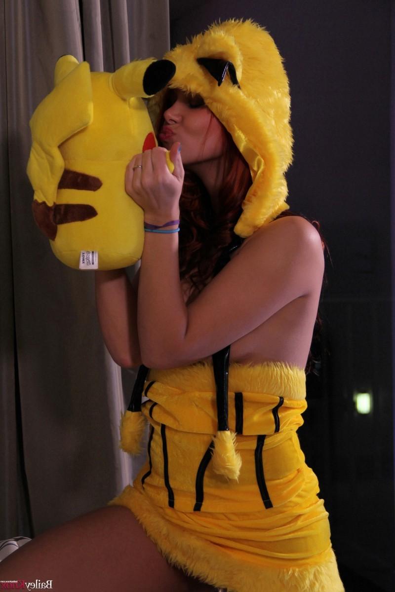 12P Cute teen posing with a Pikachu doll