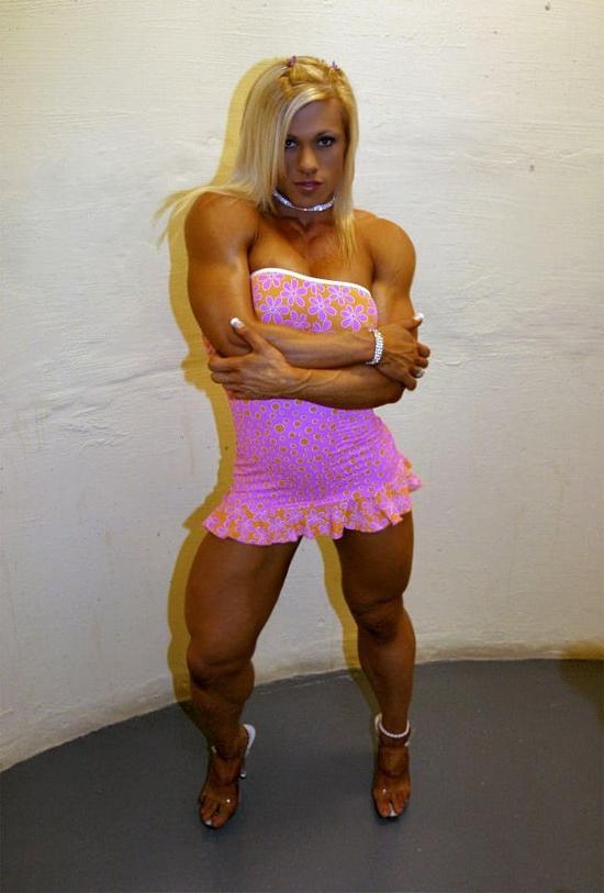 12P Very hot busty muscular blonde posing in tight dress