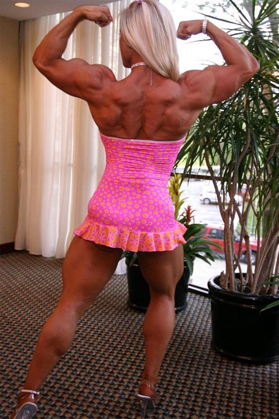 12P Very hot busty muscular blonde posing in tight dress