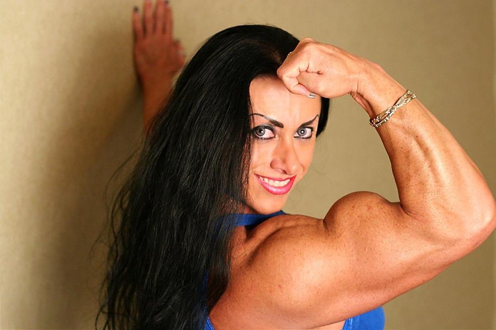 12P Muscular brunette Mistress flexing her big hard biceps