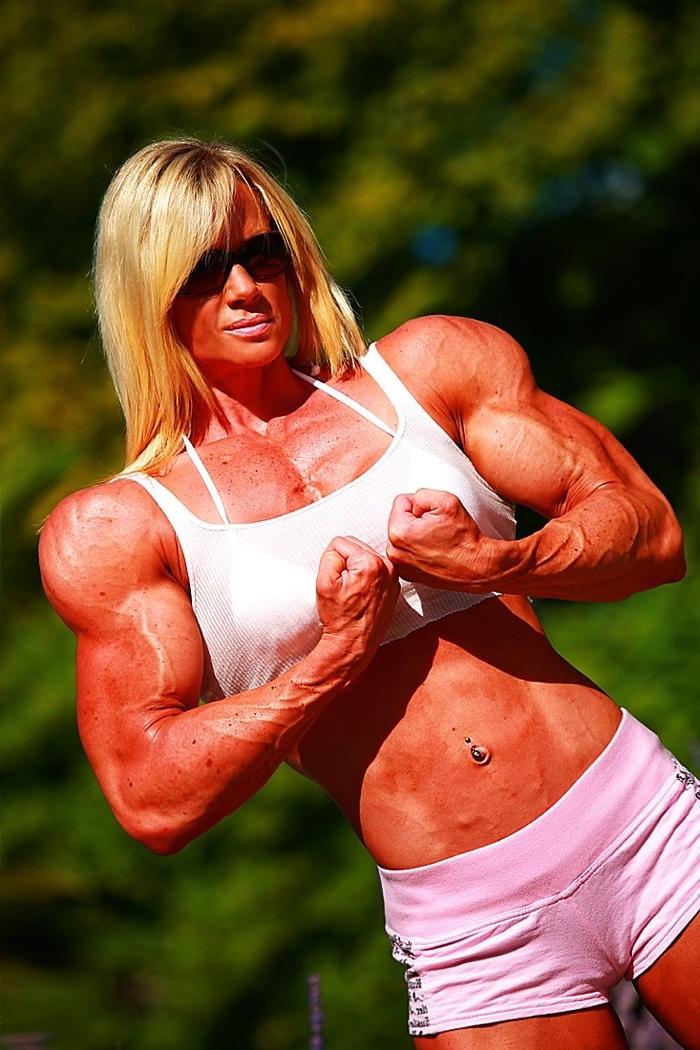 12P Massive ripped muscular woman posing outdoors