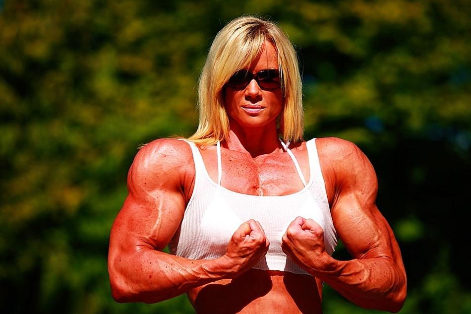 12P Massive ripped muscular woman posing outdoors
