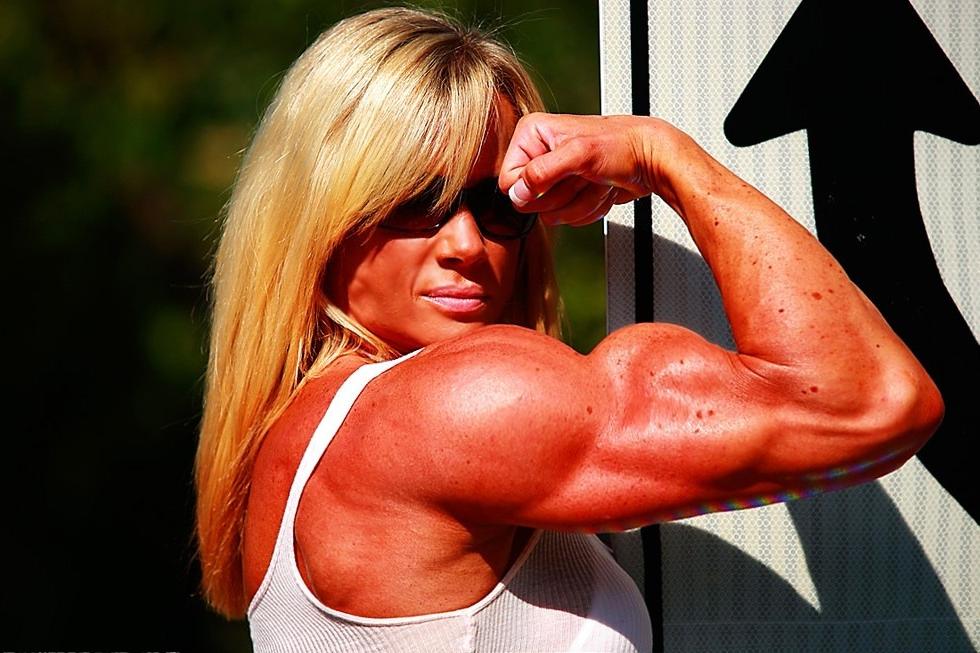 12P Massive ripped muscular woman posing outdoors