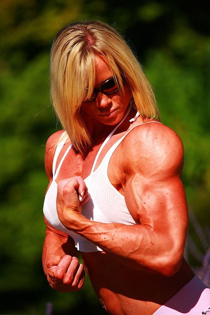 12P Massive ripped muscular woman posing outdoors