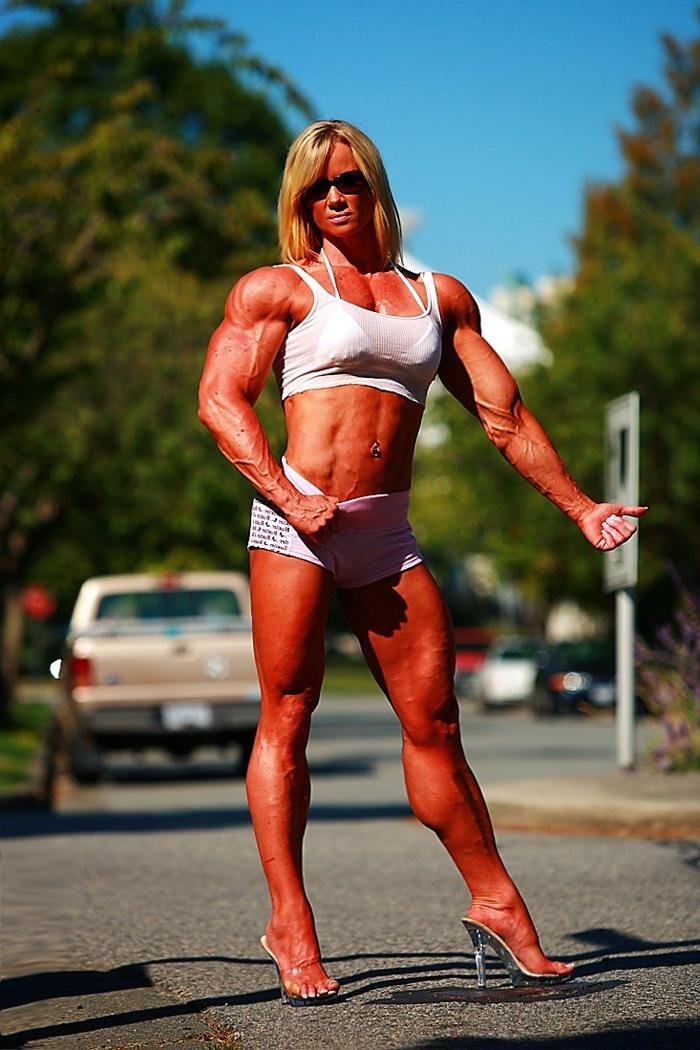 12P Massive ripped muscular woman posing outdoors
