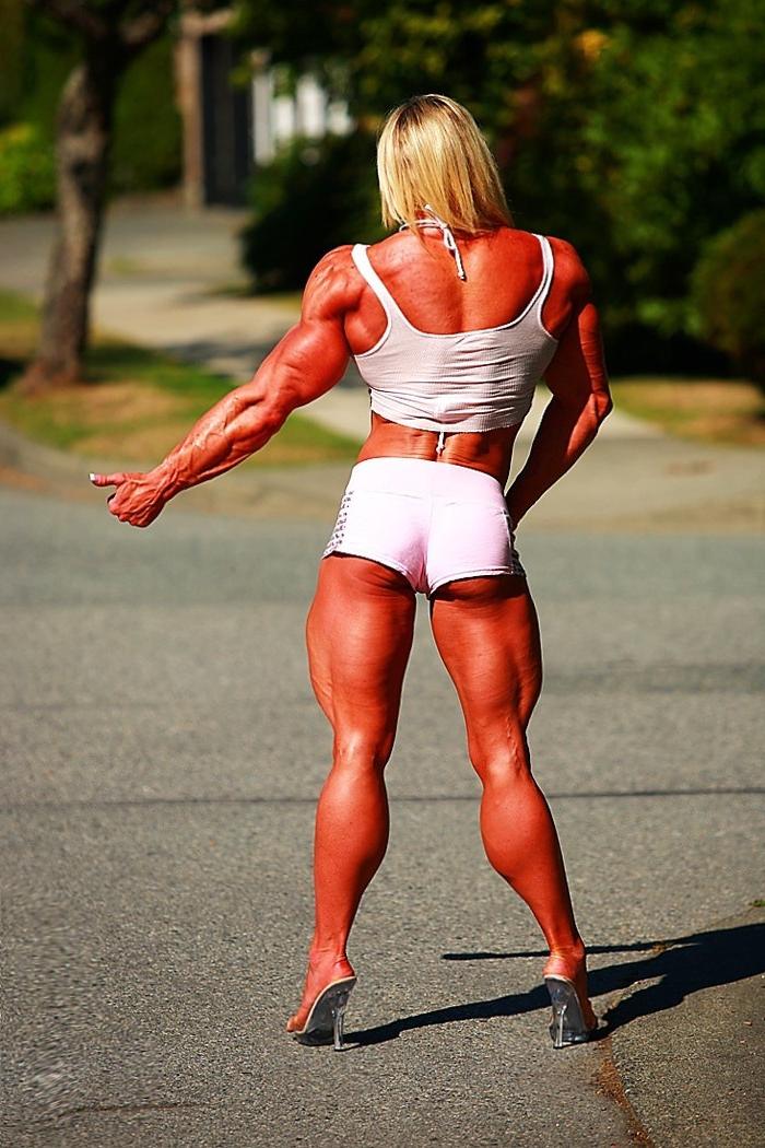 12P Massive ripped muscular woman posing outdoors