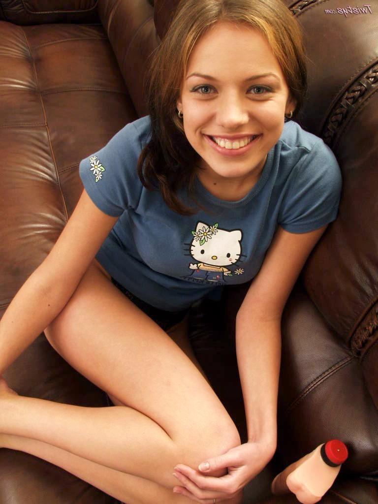 18P Busty teen Babette stuffs her tighty pussy with a big dildo on a leather couch
