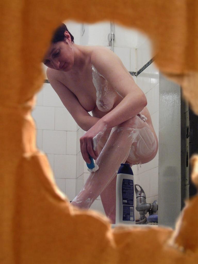 16P Voyeur fetish peeks at brunette babe shaving in the shower