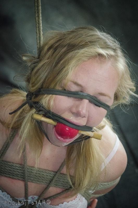 16P Tracey Sweet blonde in tight rope bondage her pussy exposed