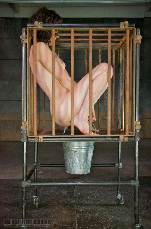 16P Bonnie Day is put in a cage on wheels and humiliated