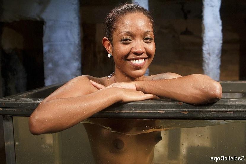 16P Lotus Lain ebony gets the bondage and water treatment with squirting orgasms
