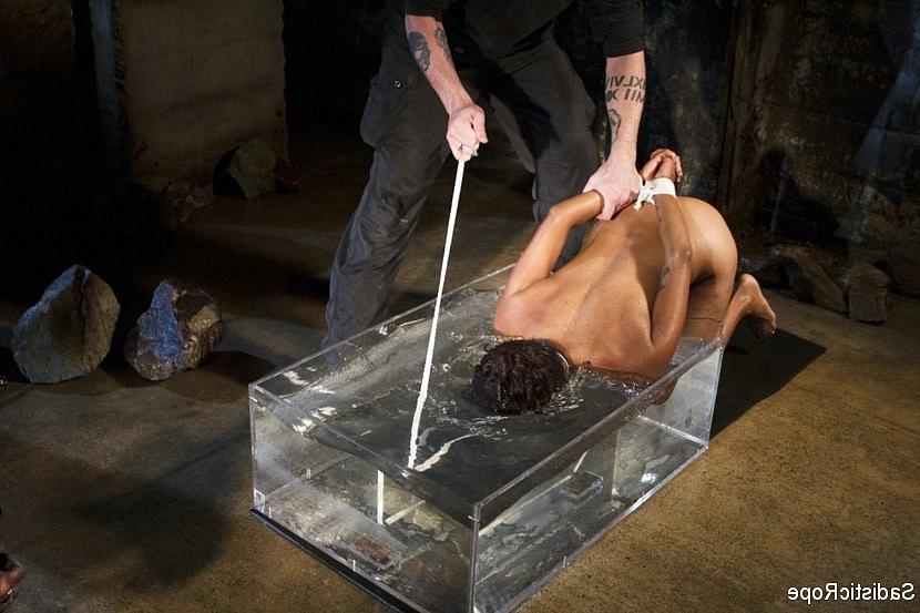 16P Lotus Lain ebony gets the bondage and water treatment with squirting orgasms