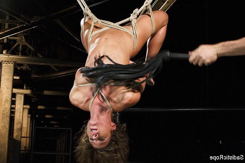 16P Ariel X in tight rope bondage is made to squirt with stick dildo in ass and puss