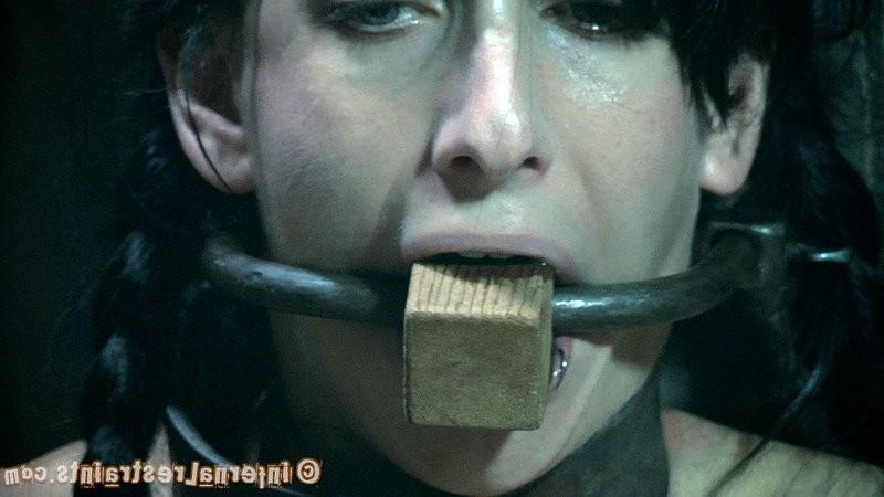 16P Elise Graves in metal bondage masked and gagged in dark dungeon