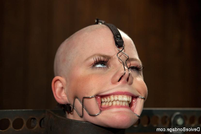 15P Alani Pi in metal device bondage gets her head completely shaved