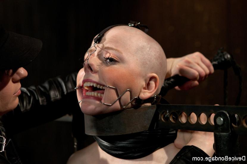 15P Alani Pi in metal device bondage gets her head completely shaved