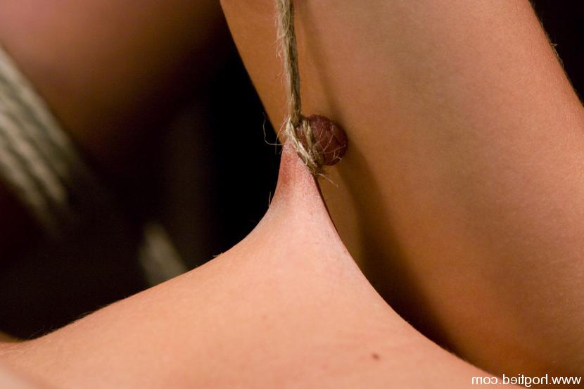 15P Sexy shaved red head get the bondage of her life on Hogtied.