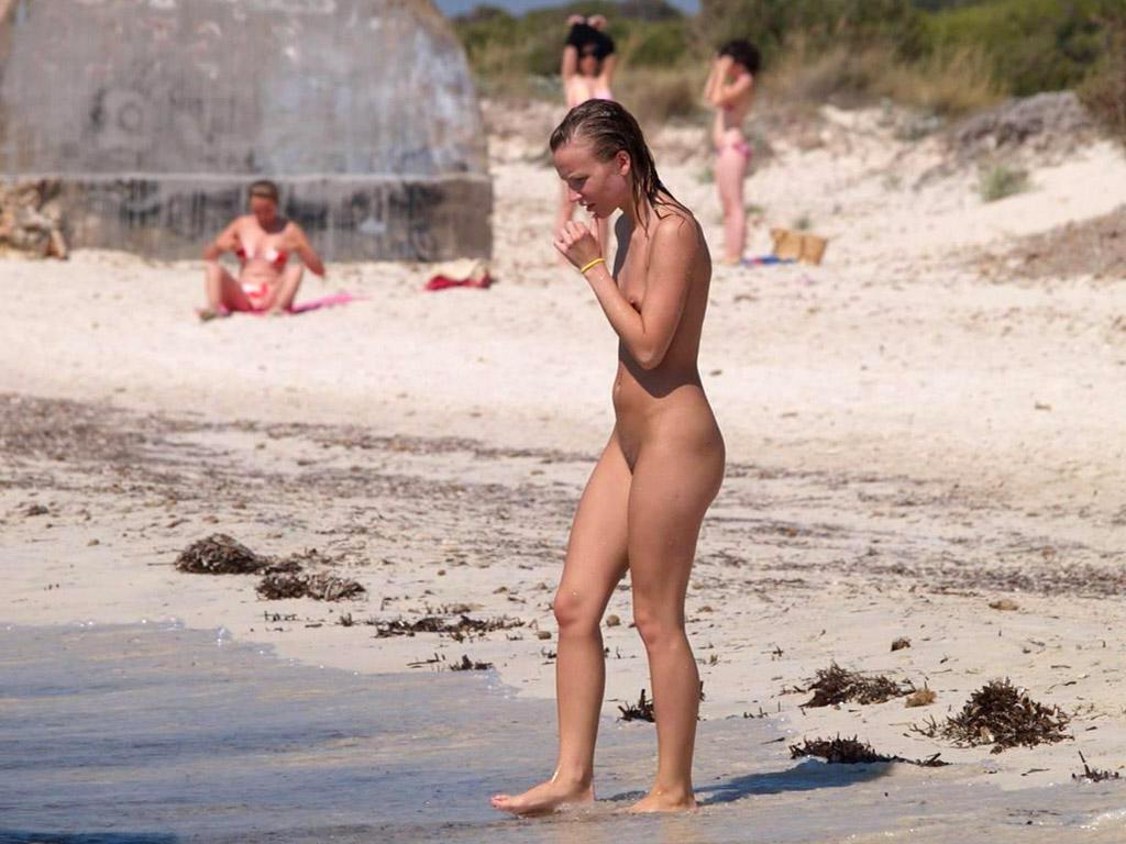 15P All eyes are on this big breasted brunette as she sunbathes