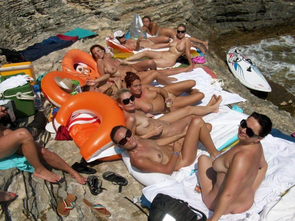 15P Watch this sexy blonde teen lay in the water naked