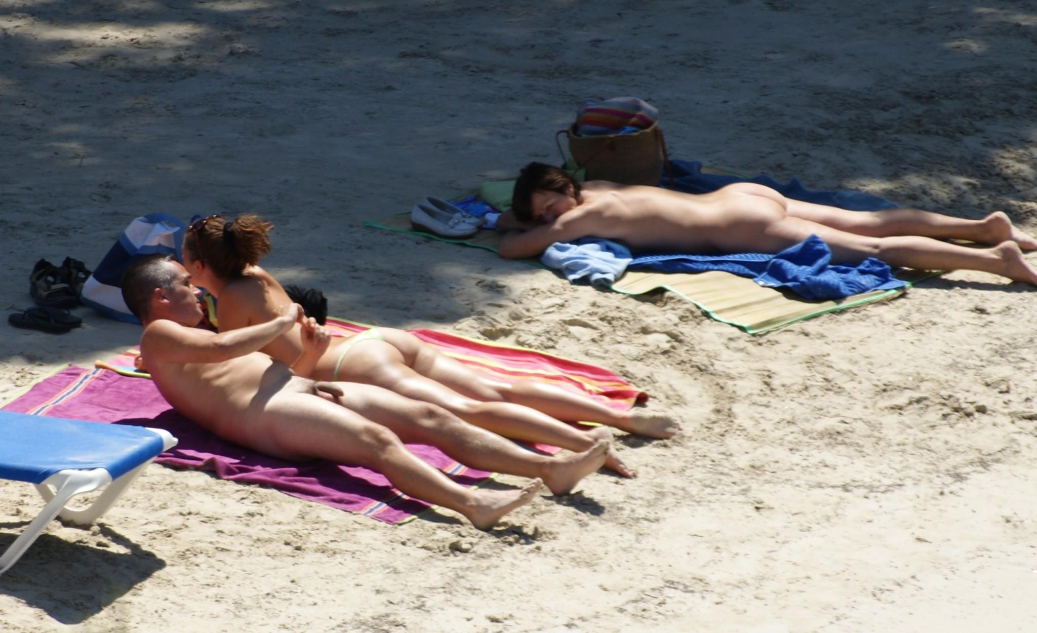 15P Blonde and brunette nude teens tanning outdoors