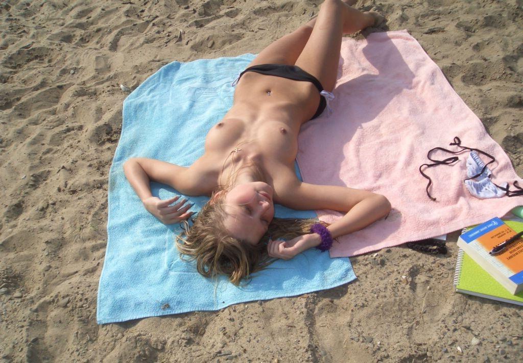 15P Busty brunette rubs her perfectly tanned nude body