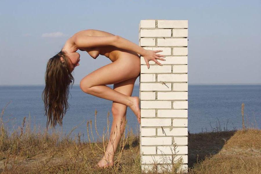 15P Sexy blonde nudist rubs her own naked body