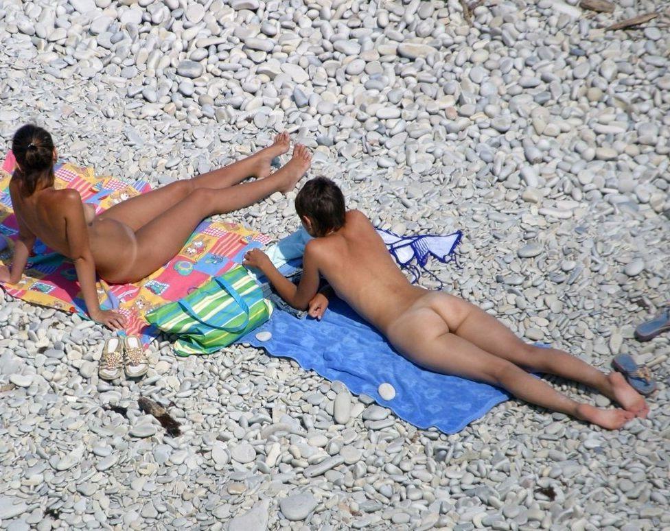 15P Gorgeous nude milf with big tits sunbathes