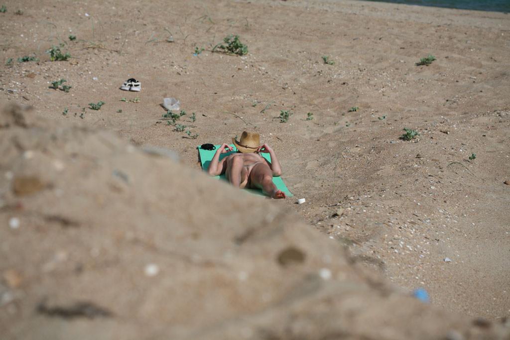 15P Sexy nudist teen strips down to tan her nude body