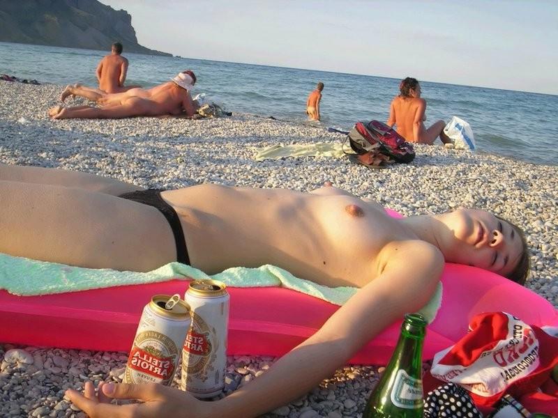 15P Her long slim nude body looks great in the sun