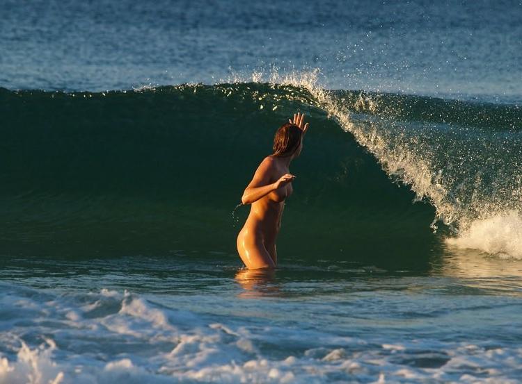 15P Wild naked chick has a great time at a nude beach