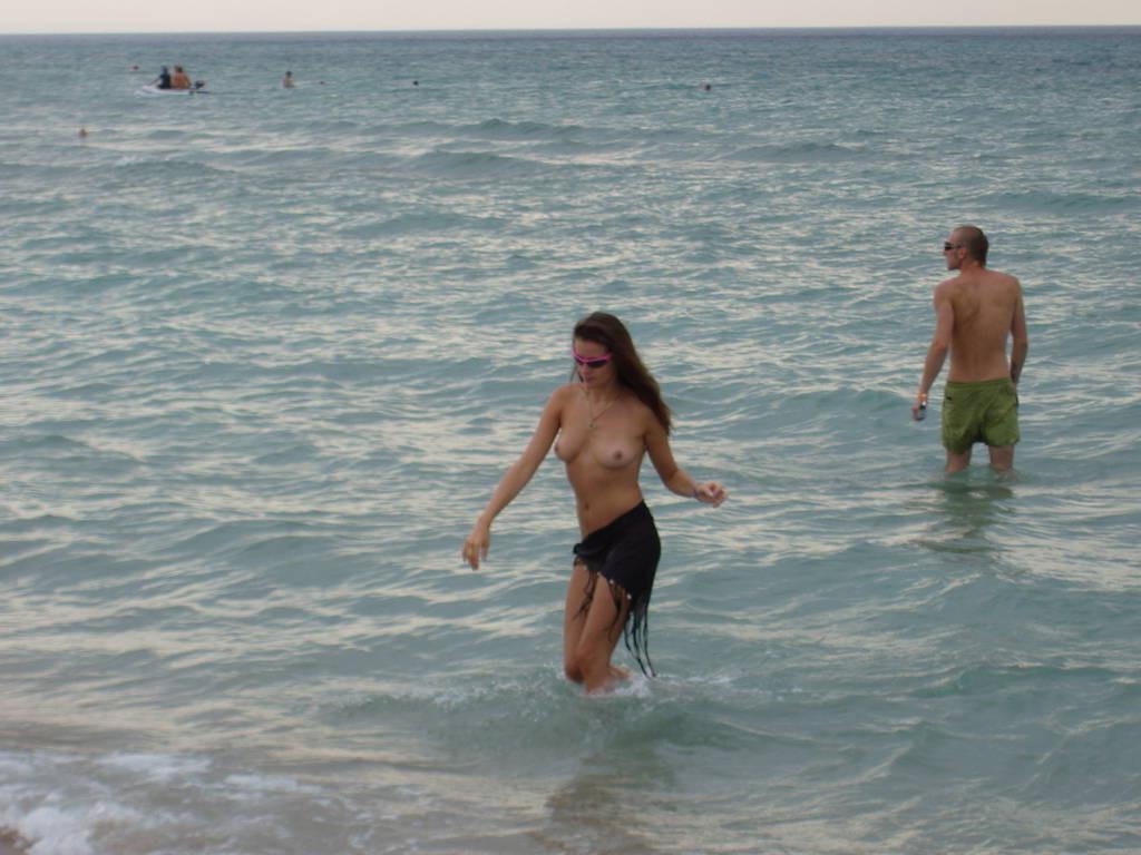 15P Watch the tits in the water from this nudist teen