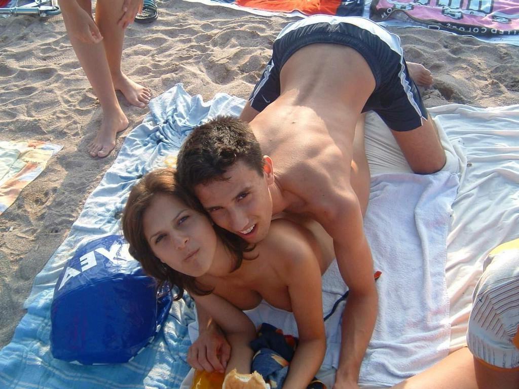 15P Watch this sexy brunette babe lay in the water naked