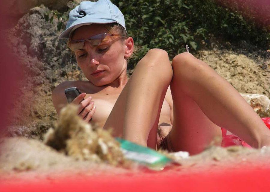 15P Watch this sexy brunette babe lay in the water naked