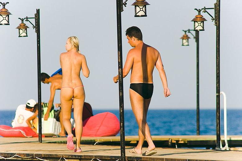 14P Hot Russian nudist strips her bikini off here