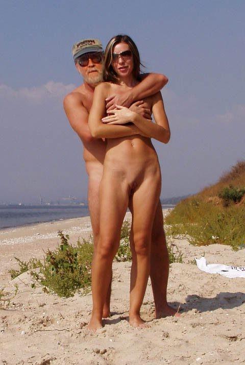14P Hot Russian nudist strips her bikini off here