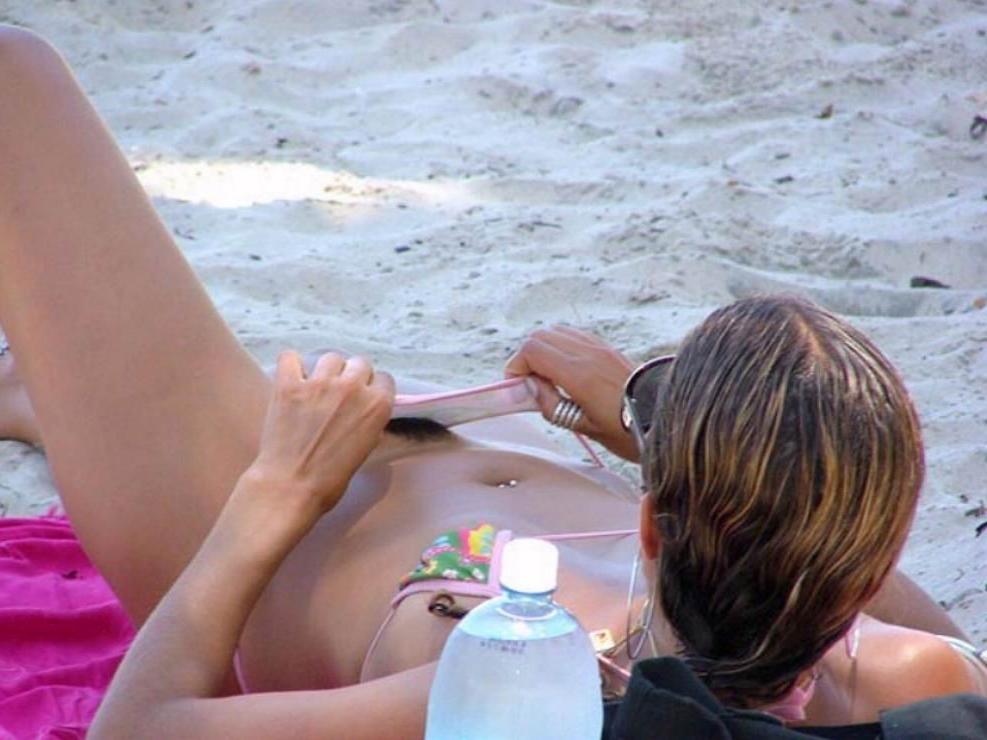 15P Her sexy body gets a tan after she strips naked