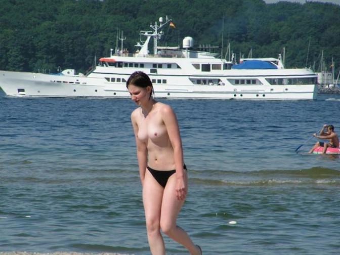 15P Watch the tits in the water from this nudist babe