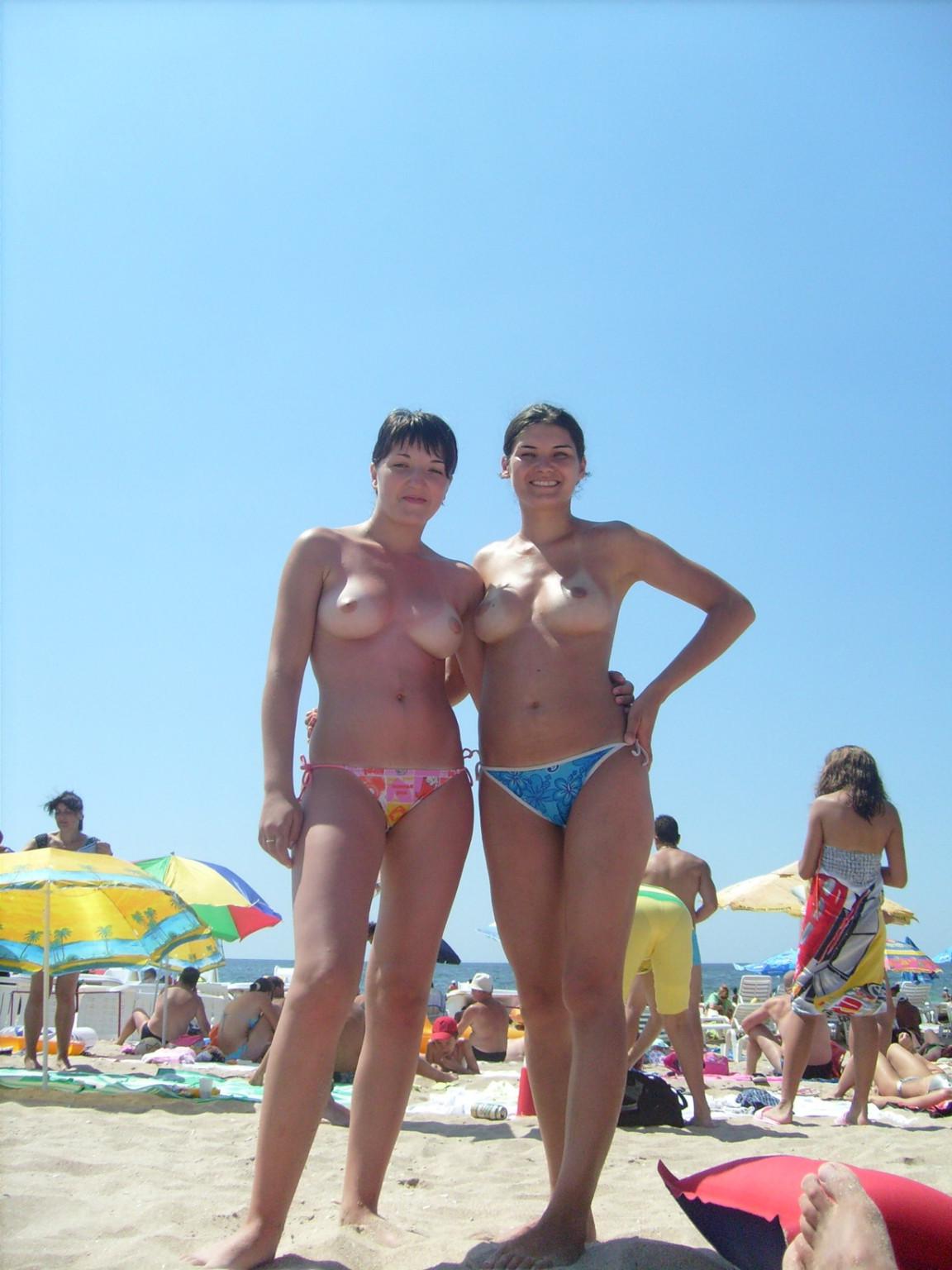 15P Hot Russian nudist strips her bikini off here