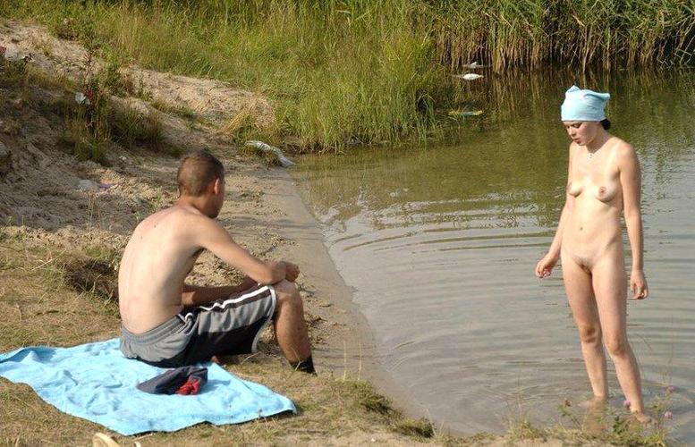15P Her sexy body gets a tan after she strips naked