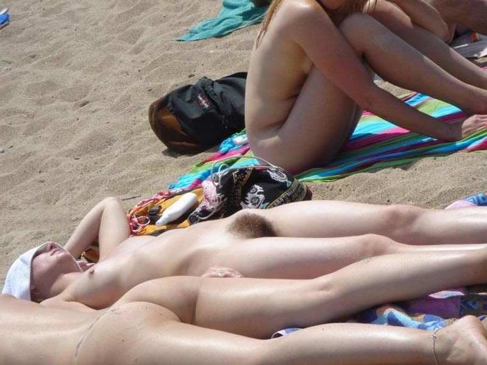 15P Watch this sexy blonde teen lay in the water naked